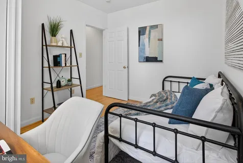 a view of living room with furniture and wooden floor