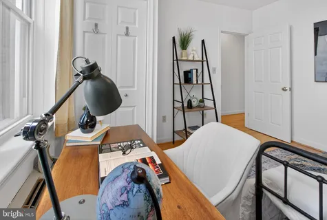 a bedroom with furniture and a window