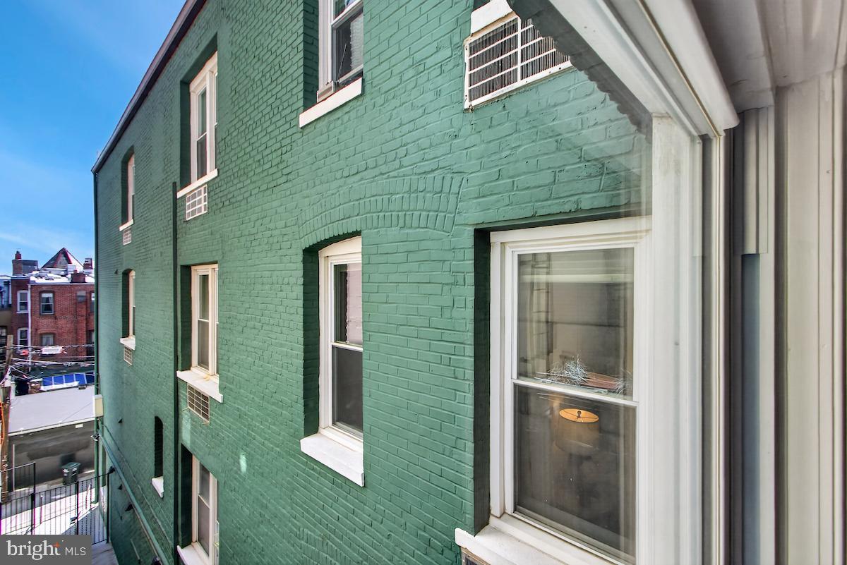 1810 California Street Northwest, Unit 202 Washington, DC 20009 - Photo 45 of 52 Charming green brick facade view.