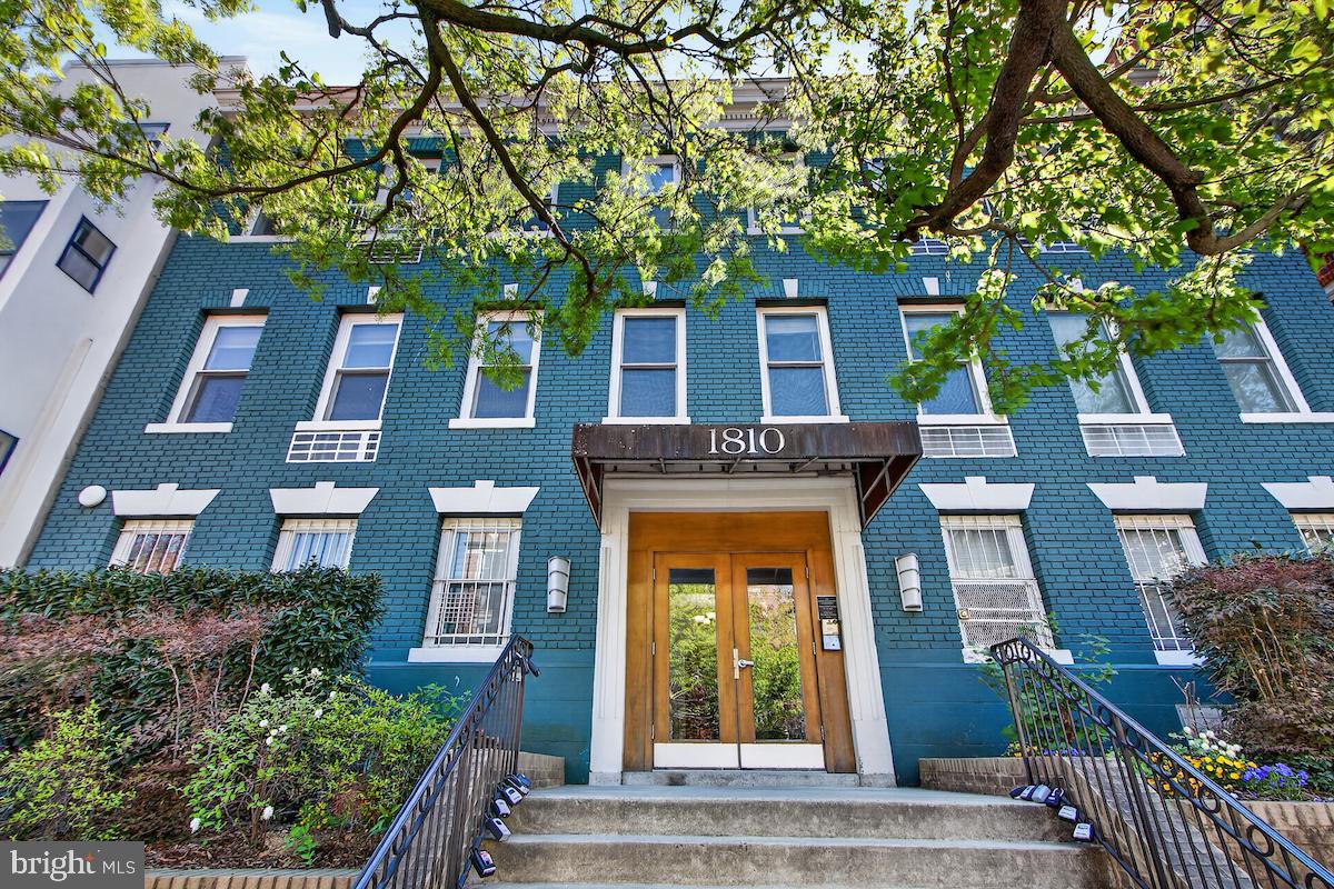 1810 California Street Northwest, Unit 202 Washington, DC 20009 - Photo 47 of 52 Charming vintage building with lush greenery.