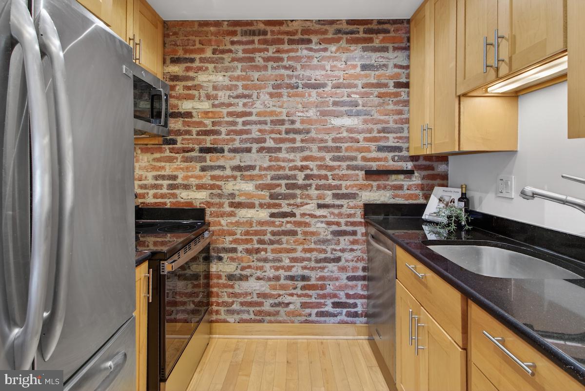 1810 California Street Northwest, Unit 202 Washington, DC 20009 - Photo 10 of 52 Charming kitchen with exposed brick.