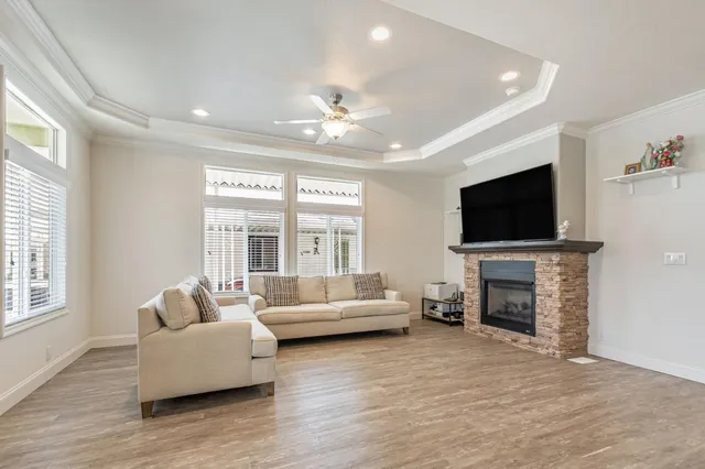 a living room with fireplace furniture and a flat screen tv
