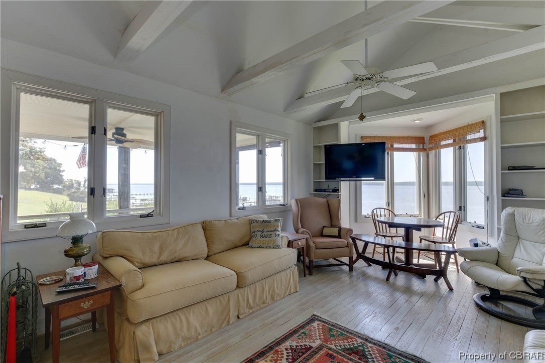 5403 Ark Road Gloucester, VA 23061 - Photo 10 of 50 Look at those views! Rustic hardwood floors. Built in shelving. High beamed ceiling.