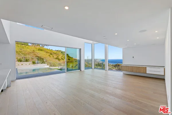 a view of kitchen with furniture and window