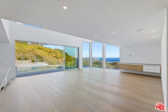 a view of kitchen with furniture and window