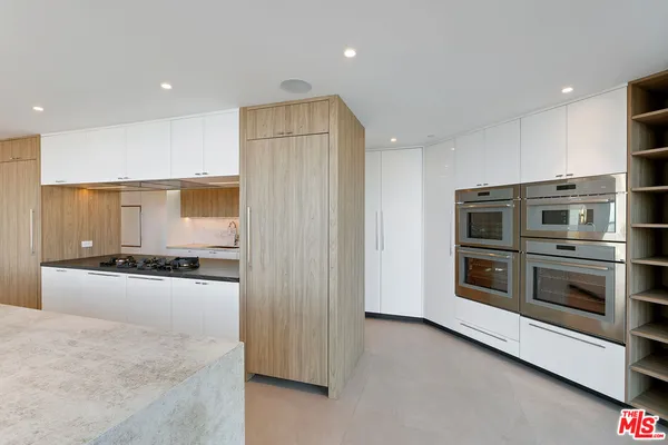 a bathroom with a sink a toilet and bathtub