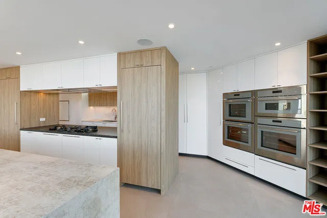 a bathroom with a sink a toilet and bathtub