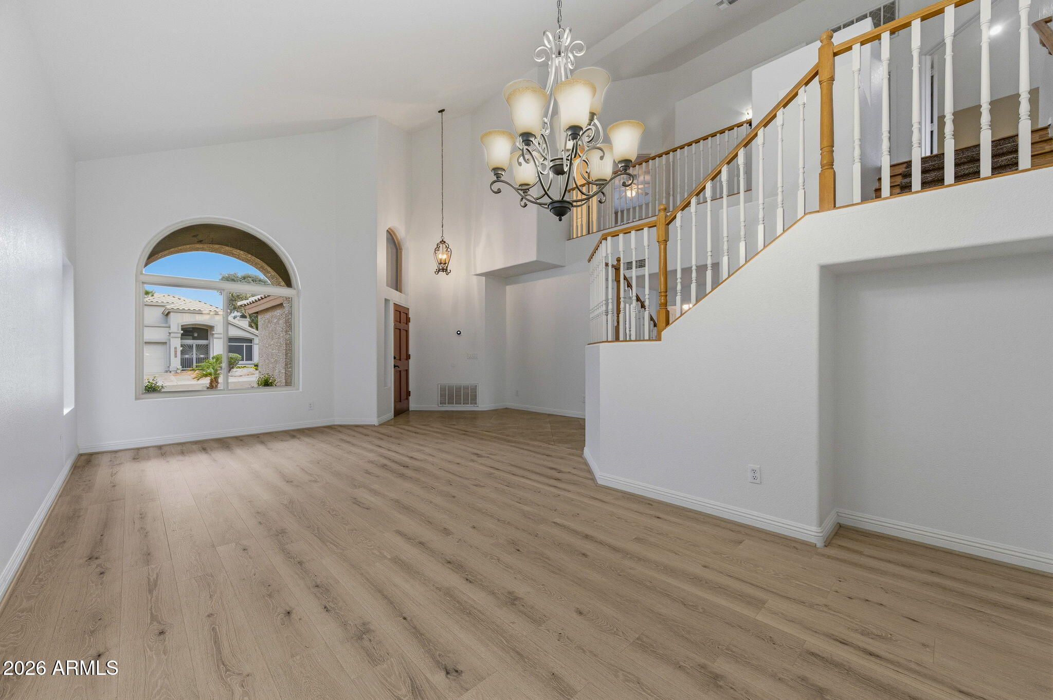 16601 South 15th Street Phoenix, AZ 85048 - Photo 16 of 62 a view of an entryway with wooden floor