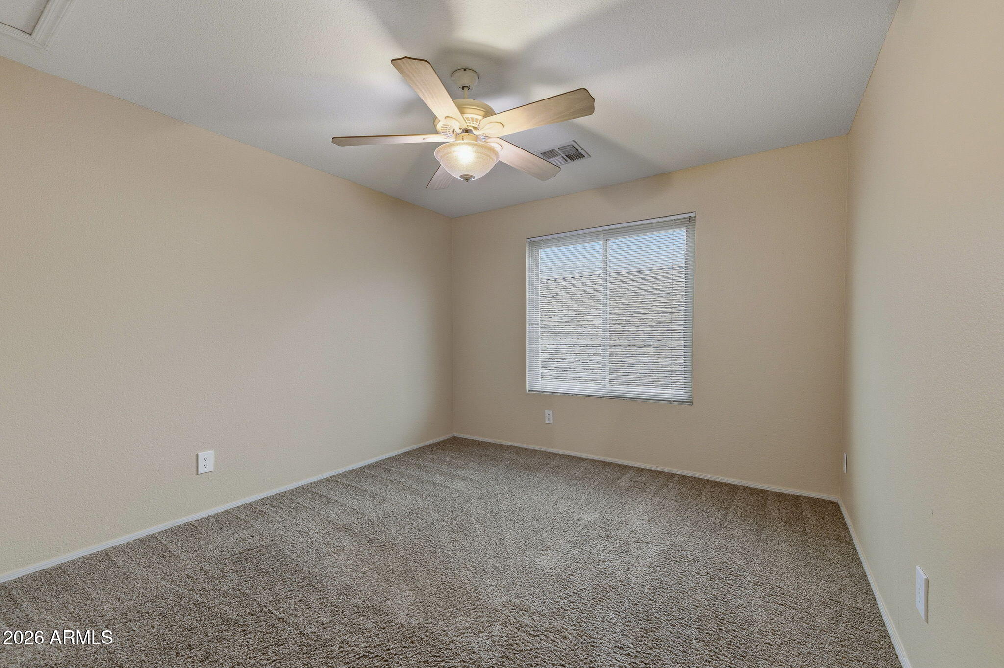 16601 South 15th Street Phoenix, AZ 85048 - Photo 25 of 62 an empty room with a window and a ceiling fan