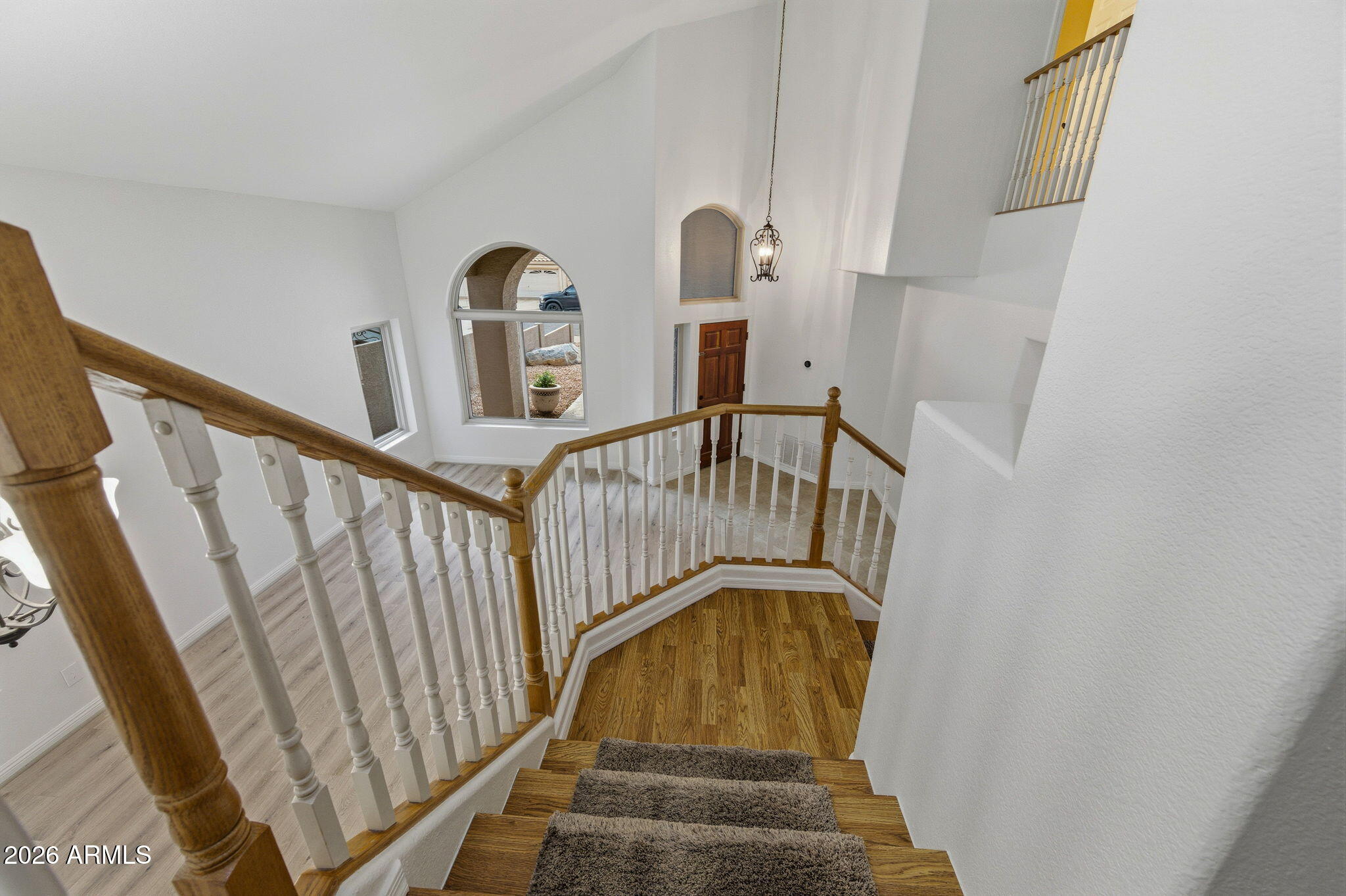 16601 South 15th Street Phoenix, AZ 85048 - Photo 31 of 62 a view of staircase with railing and white walls