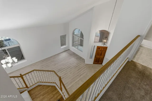 a view of a livingroom with a chandelier fan