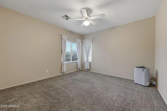 a bathroom with a sink double vanity and a mirror