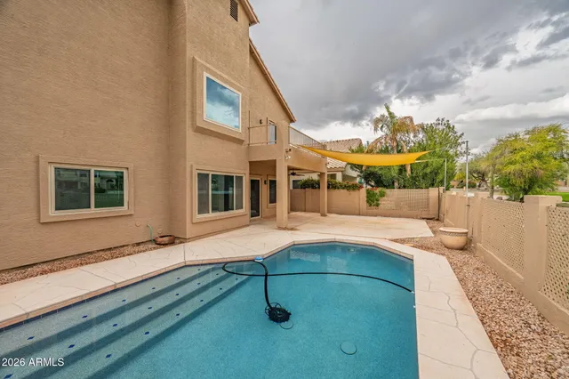 an aerial view of a house with a yard balcony