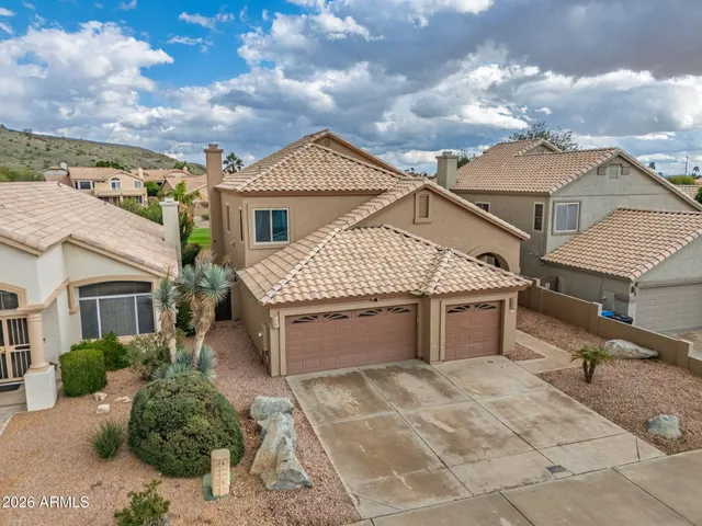 a front view of a house with yard