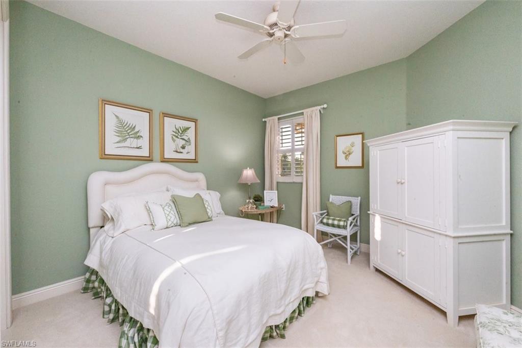 770 Regency Reserve Circle, Unit 1803 Naples, FL 34119 - Photo 21 of 35 Bedroom featuring light carpet and a ceiling fan