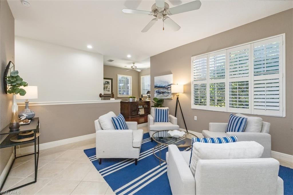 770 Regency Reserve Circle, Unit 1803 Naples, FL 34119 - Photo 6 of 35 Living room with ceiling fan, light tile patterned flooring, and recessed lighting