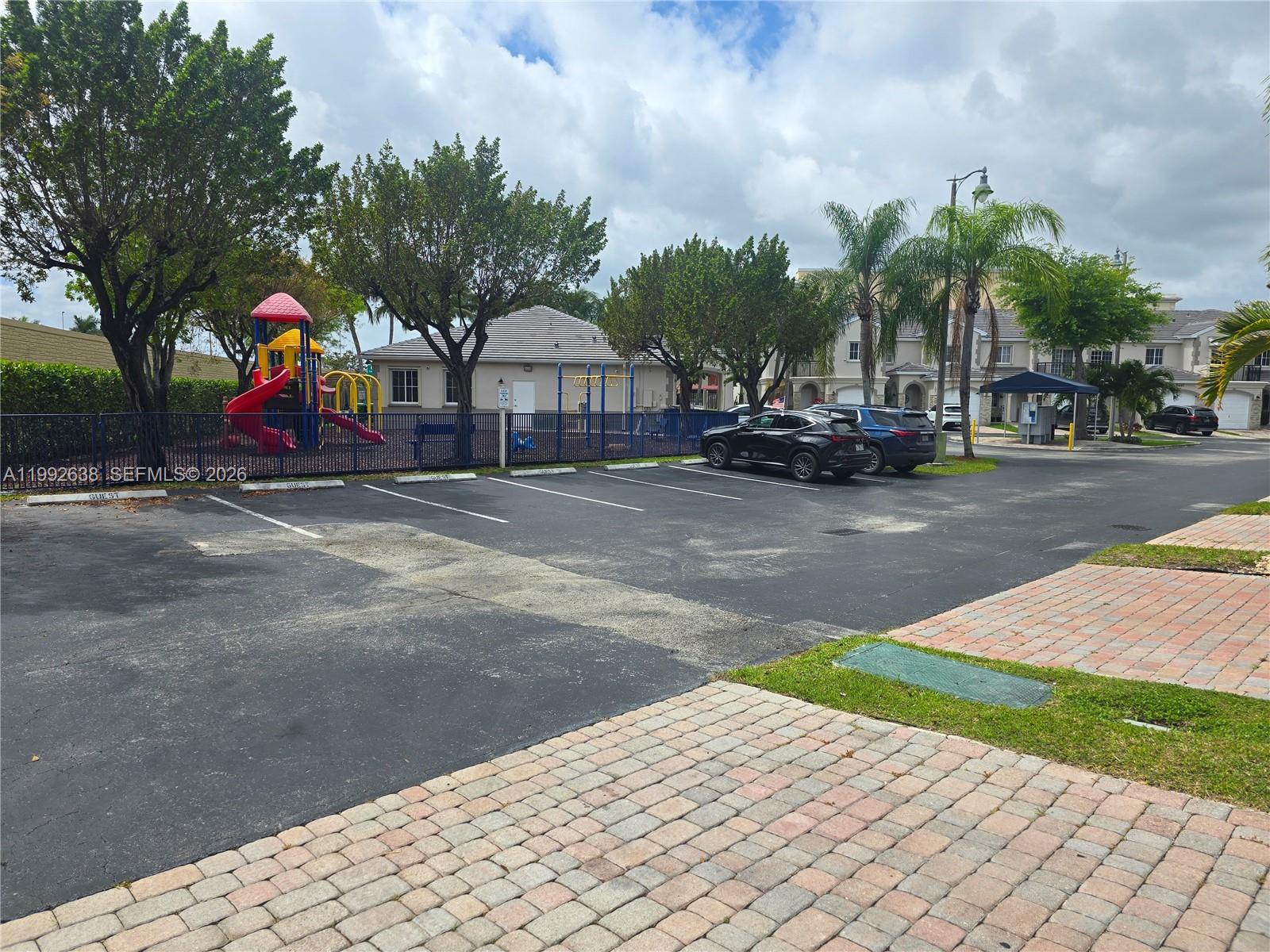 8421 Southwest 124th Avenue, Unit 101 Miami, FL 33183 - Photo 20 of 20 a view of a park with swings and slides