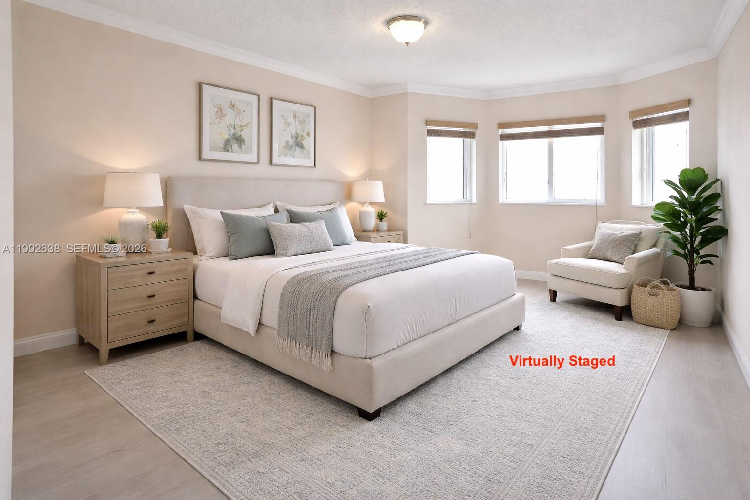 8421 Southwest 124th Avenue, Unit 101 Miami, FL 33183 - Photo 2 of 20 a bedroom with bed couch and window