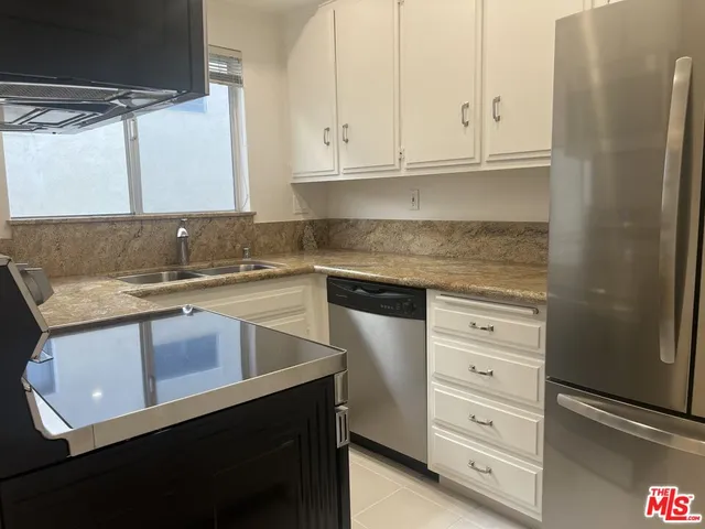 a front view of a house with trees