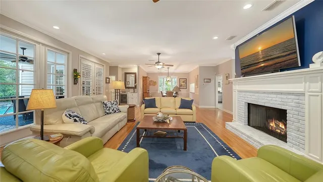 a living room with furniture fireplace and flat screen tv