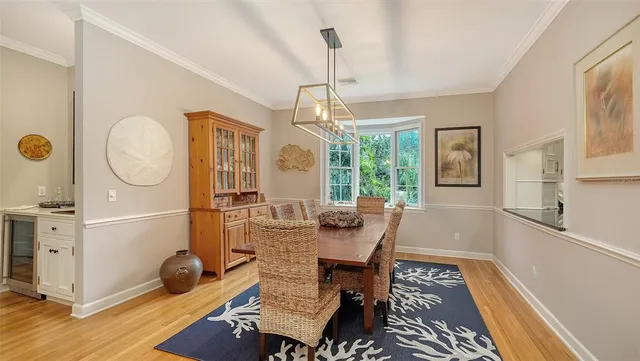 a kitchen with stainless steel appliances granite countertop a sink stove and wooden floor