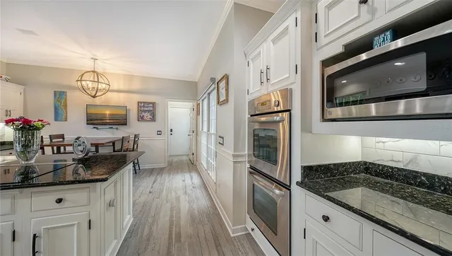 a bedroom with a bed and glass windows