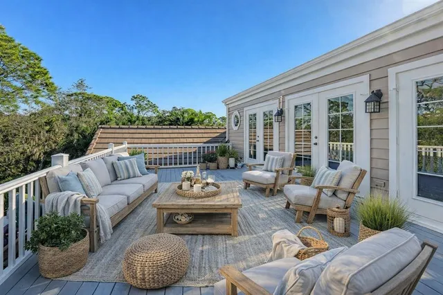 a view of a house with backyard sitting area and garden