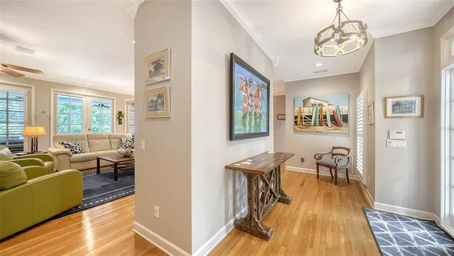 a living room with furniture kitchen view and a fireplace