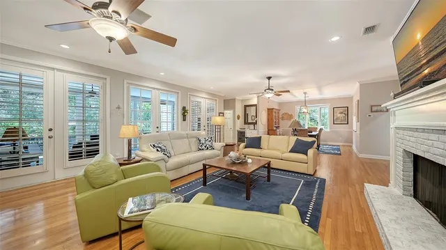 a living room with furniture fireplace and a flat screen tv