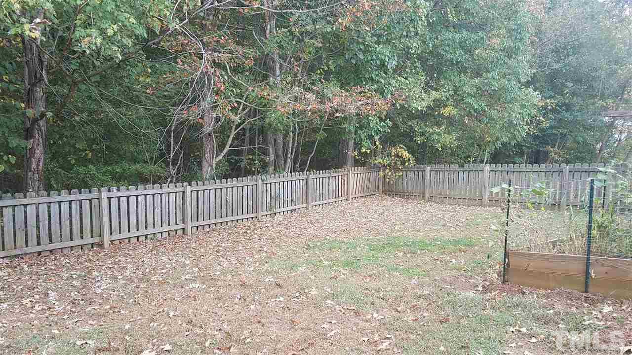 6012 Newhall Road Durham, NC 27713 - Photo 23 of 23 a backyard of a house