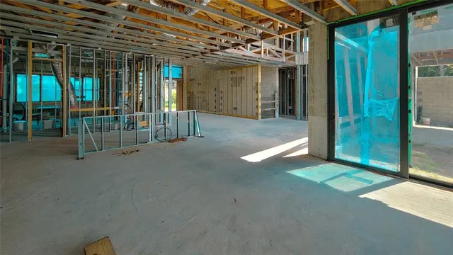 a view of an empty room with windows