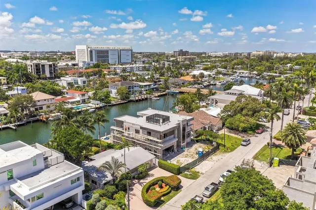 an aerial view of residential houses with outdoor space