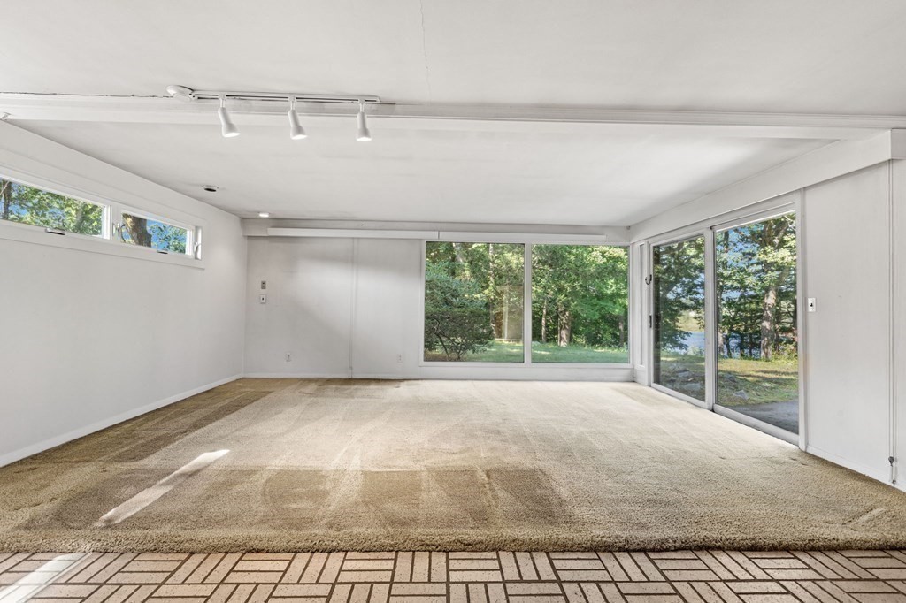 68 Harwood Road Natick, MA 01760 - Photo 17 of 37 a view of an empty room with a window
