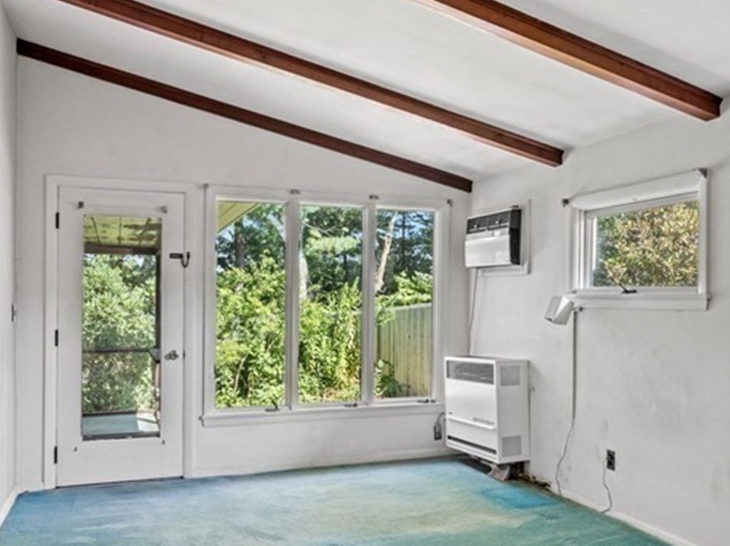 68 Harwood Road Natick, MA 01760 - Photo 8 of 37 a view of an empty room with wooden floor and a window