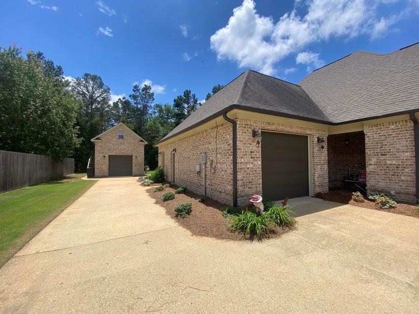 295 North Ridge Drive Saltillo, MS 38866 - Photo 37 of 38 a front view of a house with a yard and garage