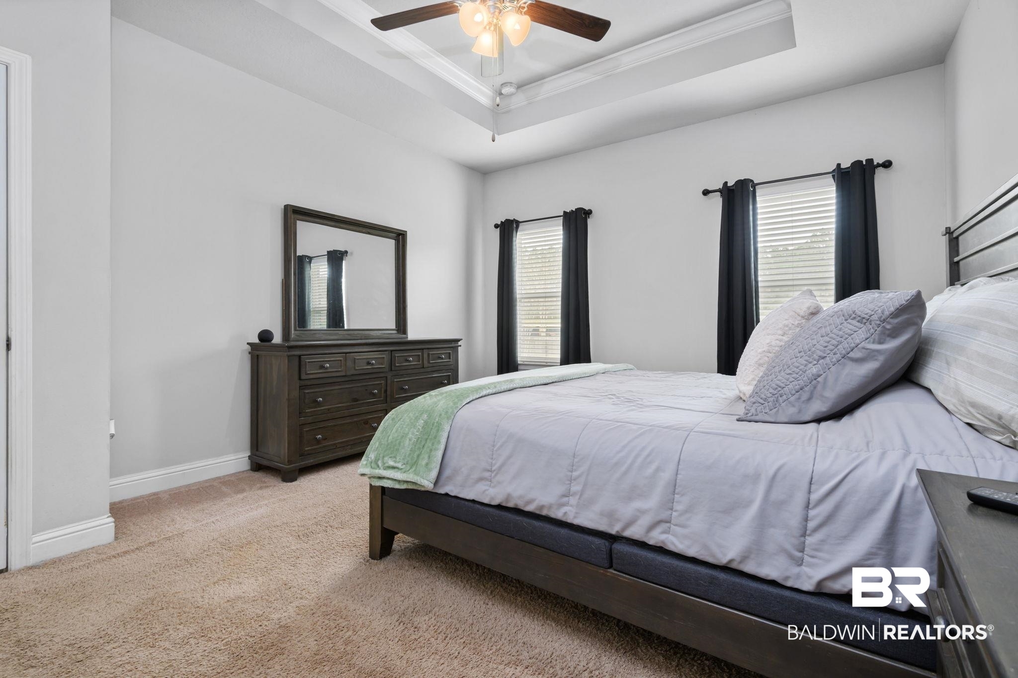 12693 Waxwing Avenue Daphne, AL 36527 - Photo 33 of 43 Bedroom with crown molding, light carpet, multiple windows, ceiling fan, and a tray ceiling