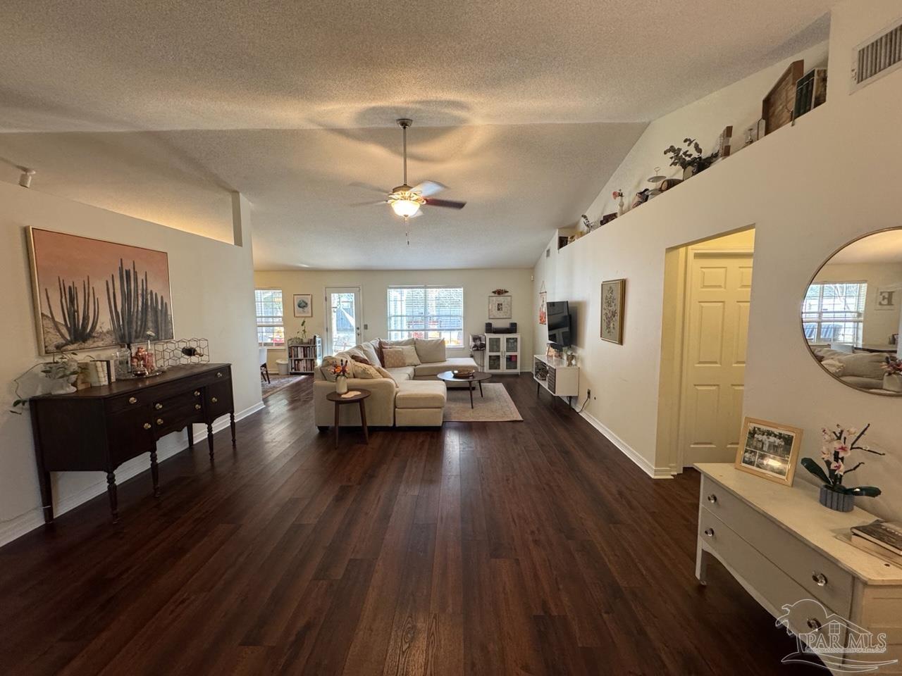 4930 Chads Circle Pace, FL 32571 - Photo 14 of 18 a living room with furniture and wooden floor