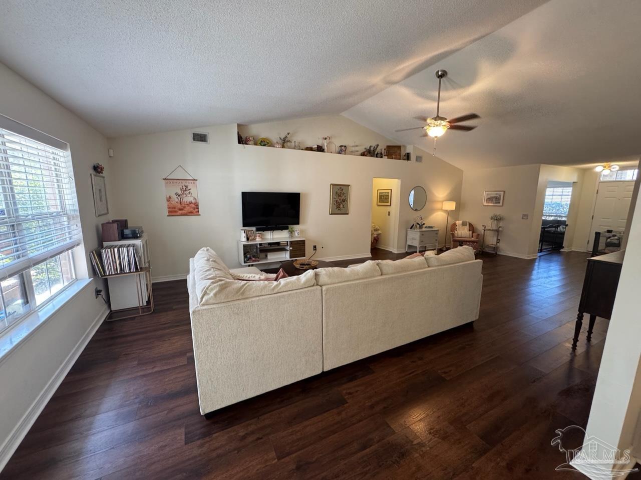 4930 Chads Circle Pace, FL 32571 - Photo 15 of 18 a living room with furniture and a flat screen tv
