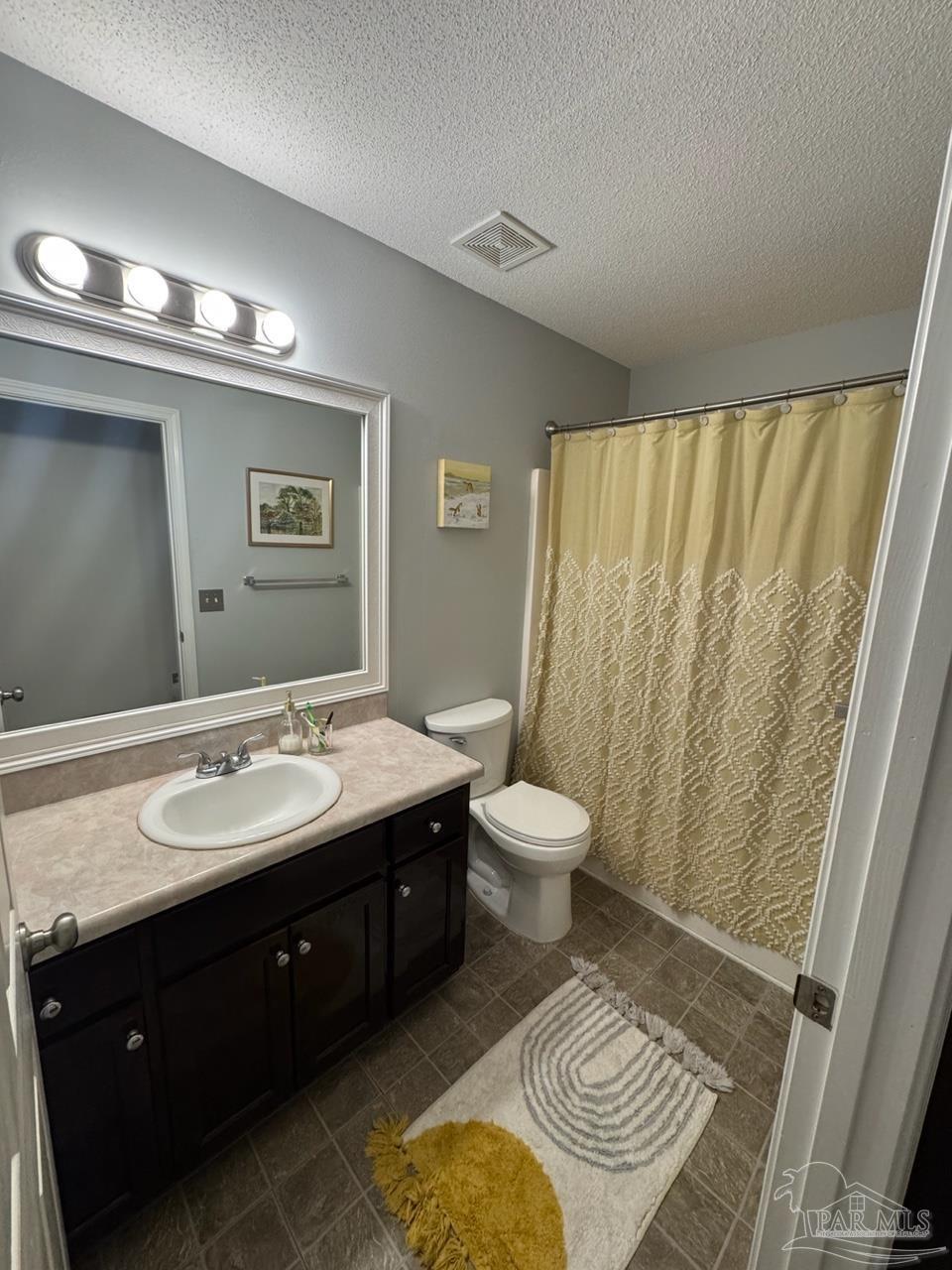 4930 Chads Circle Pace, FL 32571 - Photo 9 of 18 a spacious bathroom with a sink and a mirror