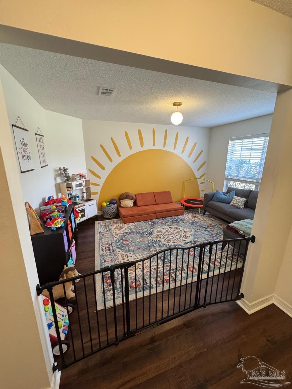 4930 Chads Circle Pace, FL 32571 - Photo 10 of 18 a bed sitting in a bedroom next to a window