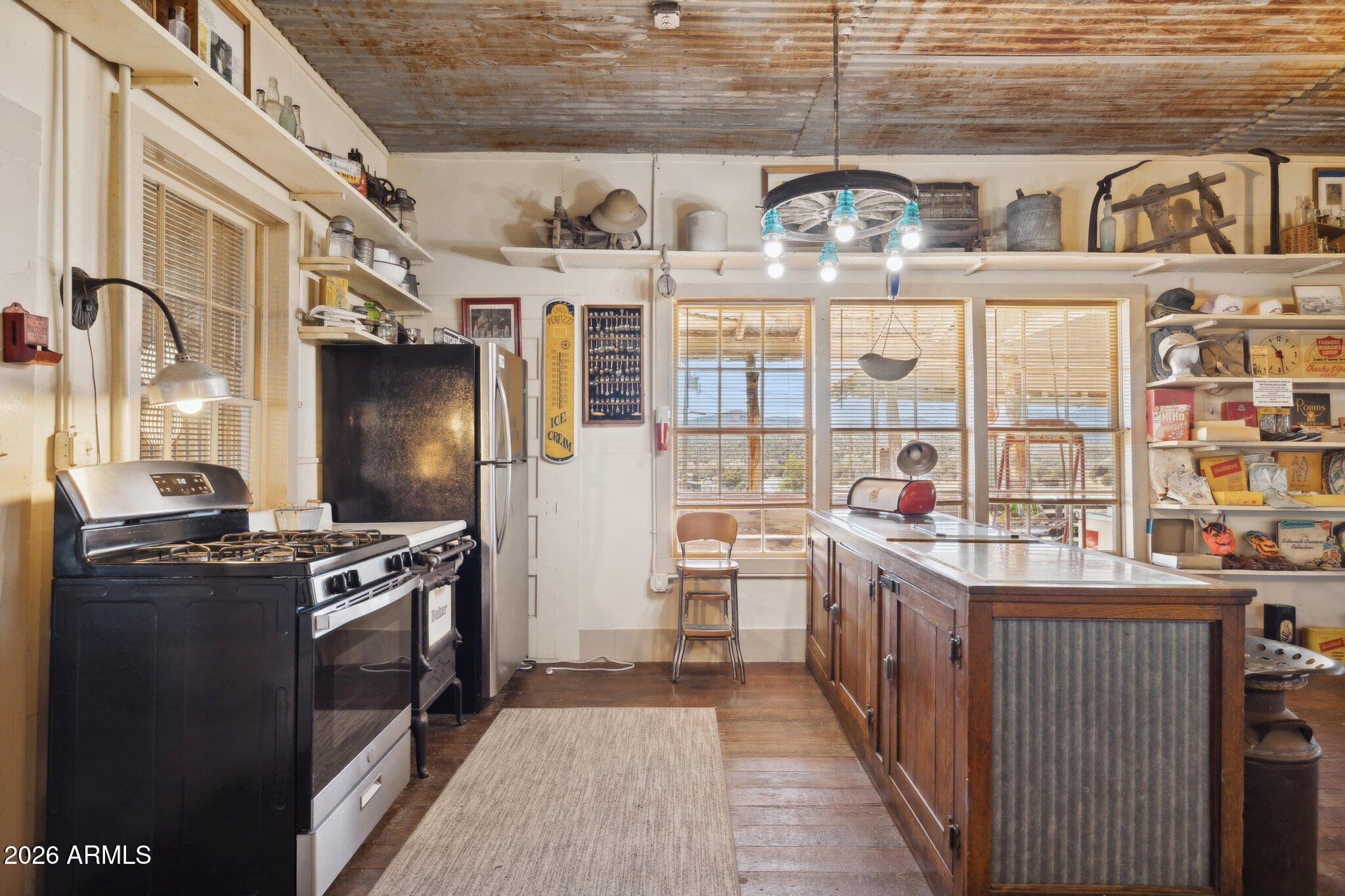 47966 Highway 288 Young, AZ 85554 - Photo 12 of 85 a kitchen with stainless steel appliances a stove and a refrigerator