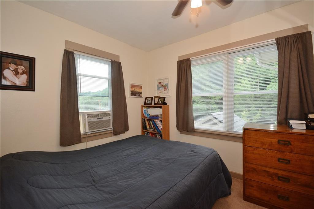 8239 Nadine Road Verona, PA 15147 - Photo 13 of 25 Good-sized master bedroom with wall to wall carpeting