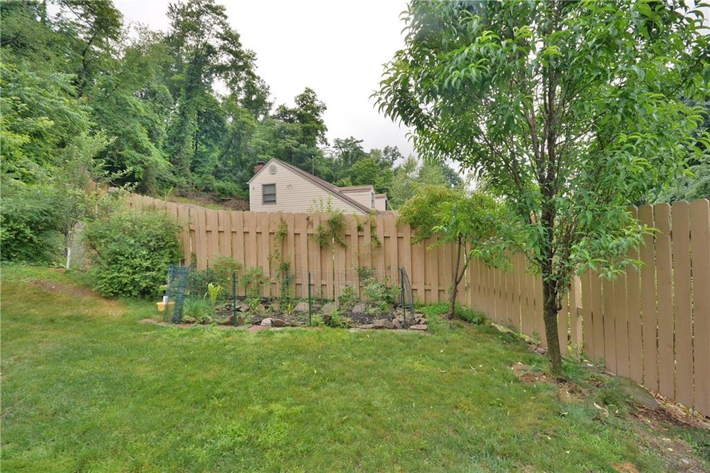 8239 Nadine Road Verona, PA 15147 - Photo 24 of 25 Side yard with small garden already planted for you!