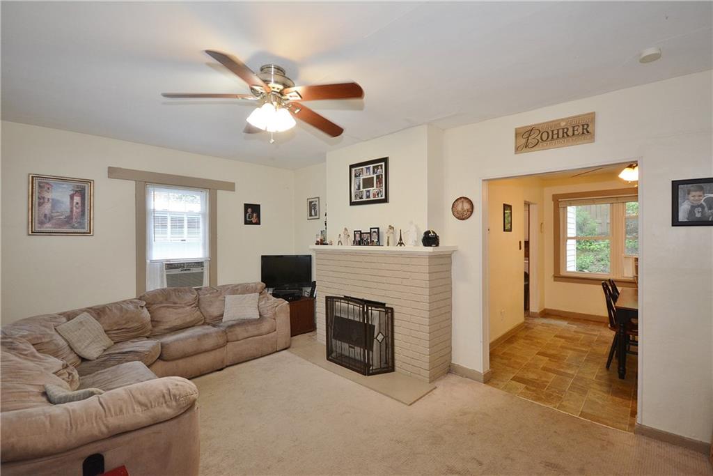 8239 Nadine Road Verona, PA 15147 - Photo 5 of 25 Another view of living room showing open floor plan leading to dining room