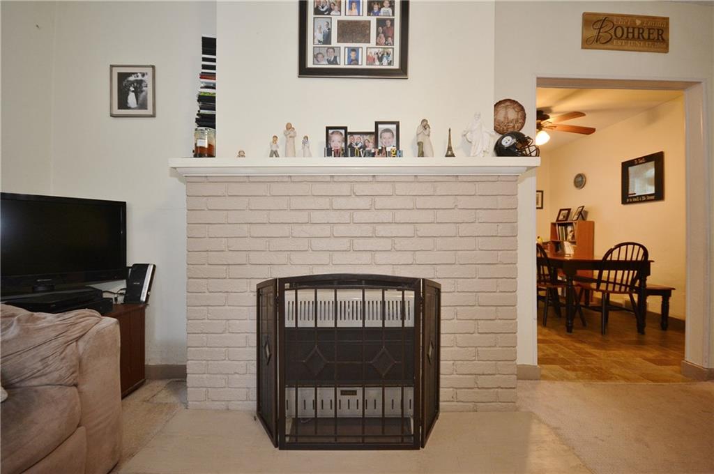 8239 Nadine Road Verona, PA 15147 - Photo 7 of 25 Imagine this gas fireplace on a cold winter evening. So cozy! Just another feature making this house a home.
