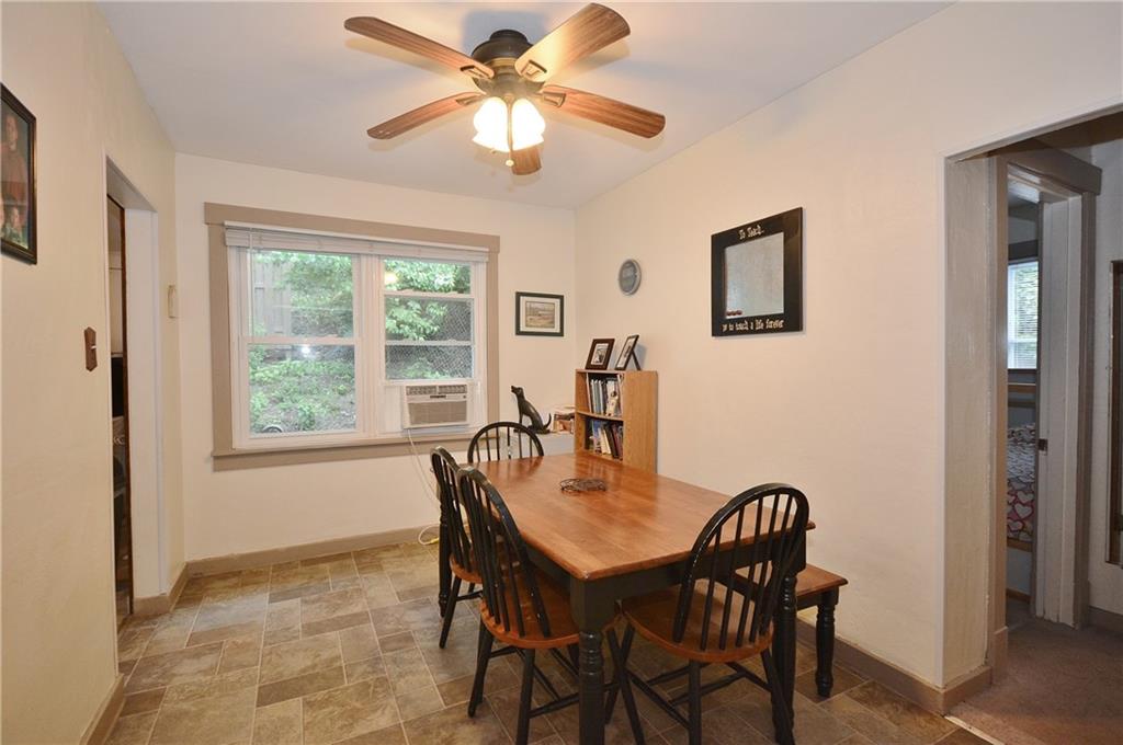 8239 Nadine Road Verona, PA 15147 - Photo 9 of 25 Another view of dining area. All window air conditioning units stay with the house.