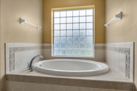 a view of an entryway with a floor to ceiling window