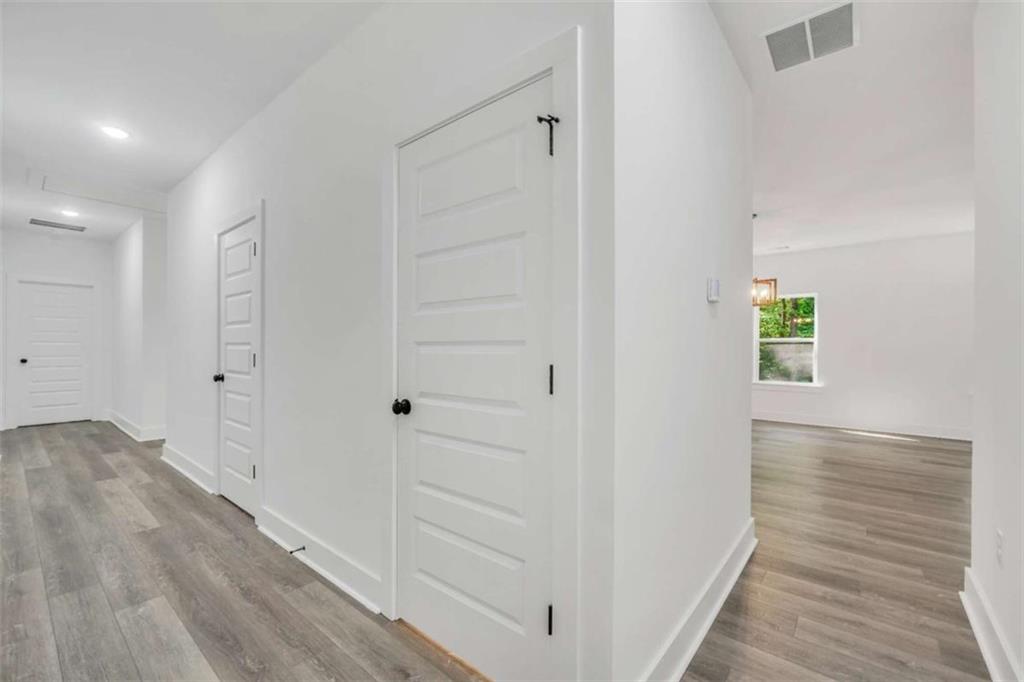 65 Lakeside Drive Covington, GA 30016 - Photo 17 of 35 a view of hallway with wooden floor