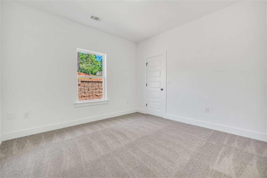 65 Lakeside Drive Covington, GA 30016 - Photo 20 of 35 an empty room with windows
