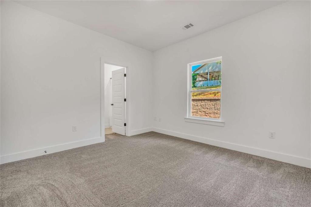 65 Lakeside Drive Covington, GA 30016 - Photo 21 of 35 an empty room with windows